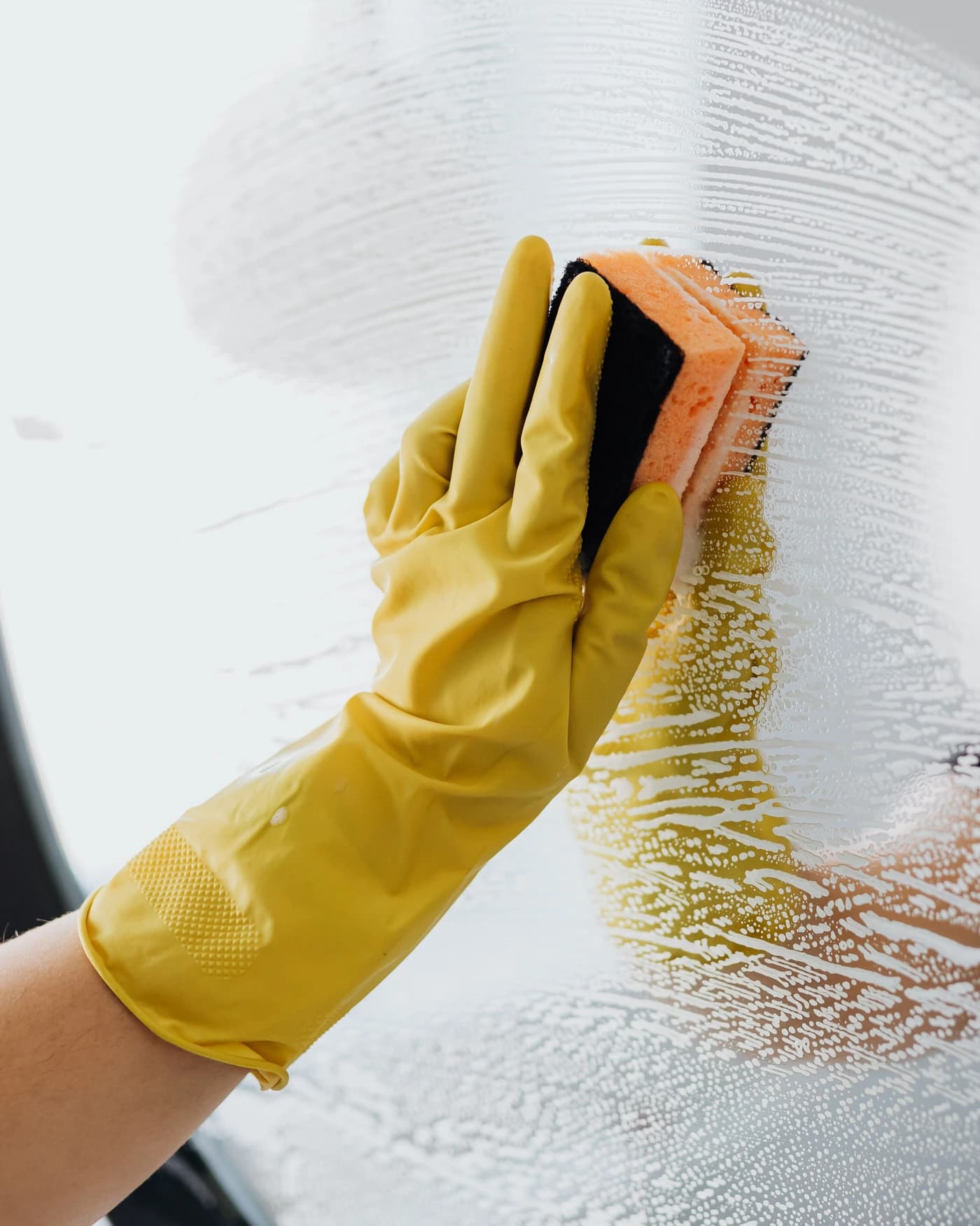 Commercial cleaner wiping glass to a streak-free finish in Echuca